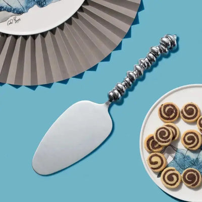 CAKE LIFTER SMALL
Wound Up